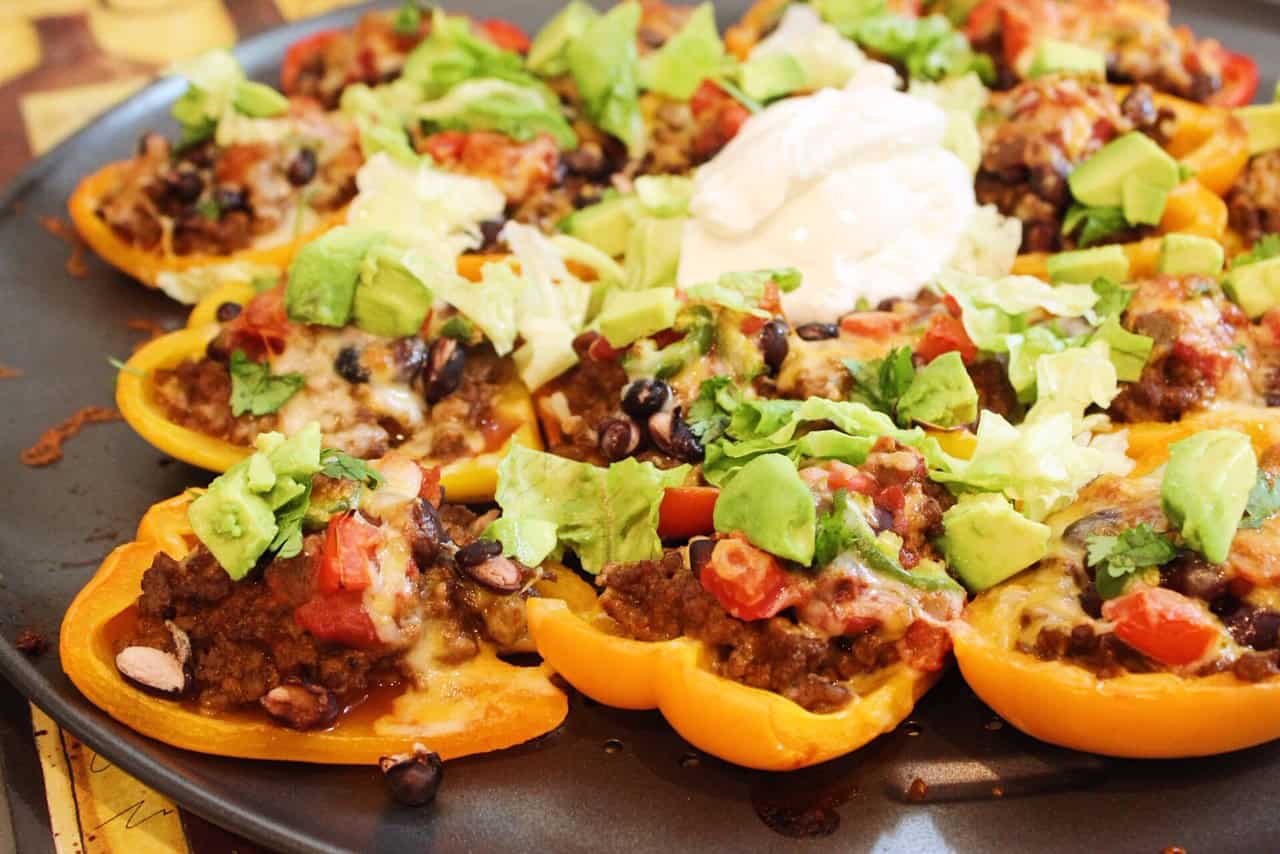 Bell Pepper Nachos on a sheet pan loaded with beef, beans, salsa, and veggies.