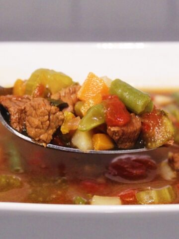 Close up picture of a spoonful of Homemade Vegetable Beef Soup