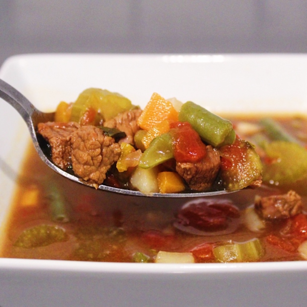 Close up picture of a spoonful of Homemade Vegetable Beef Soup