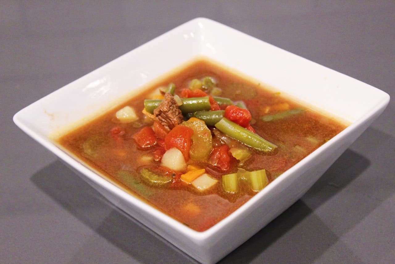 Vegetable Beef Soup in a white bowl.