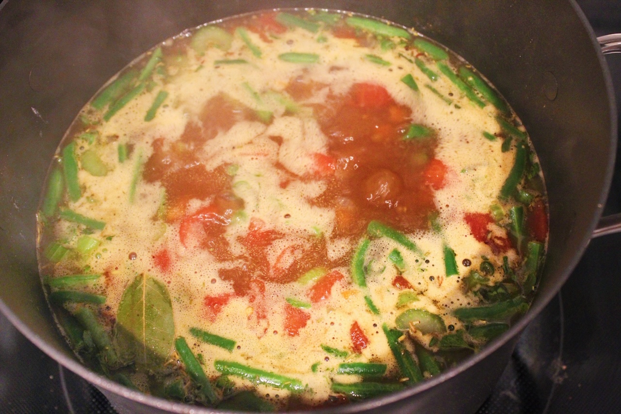 Soup simmering on the stove top.