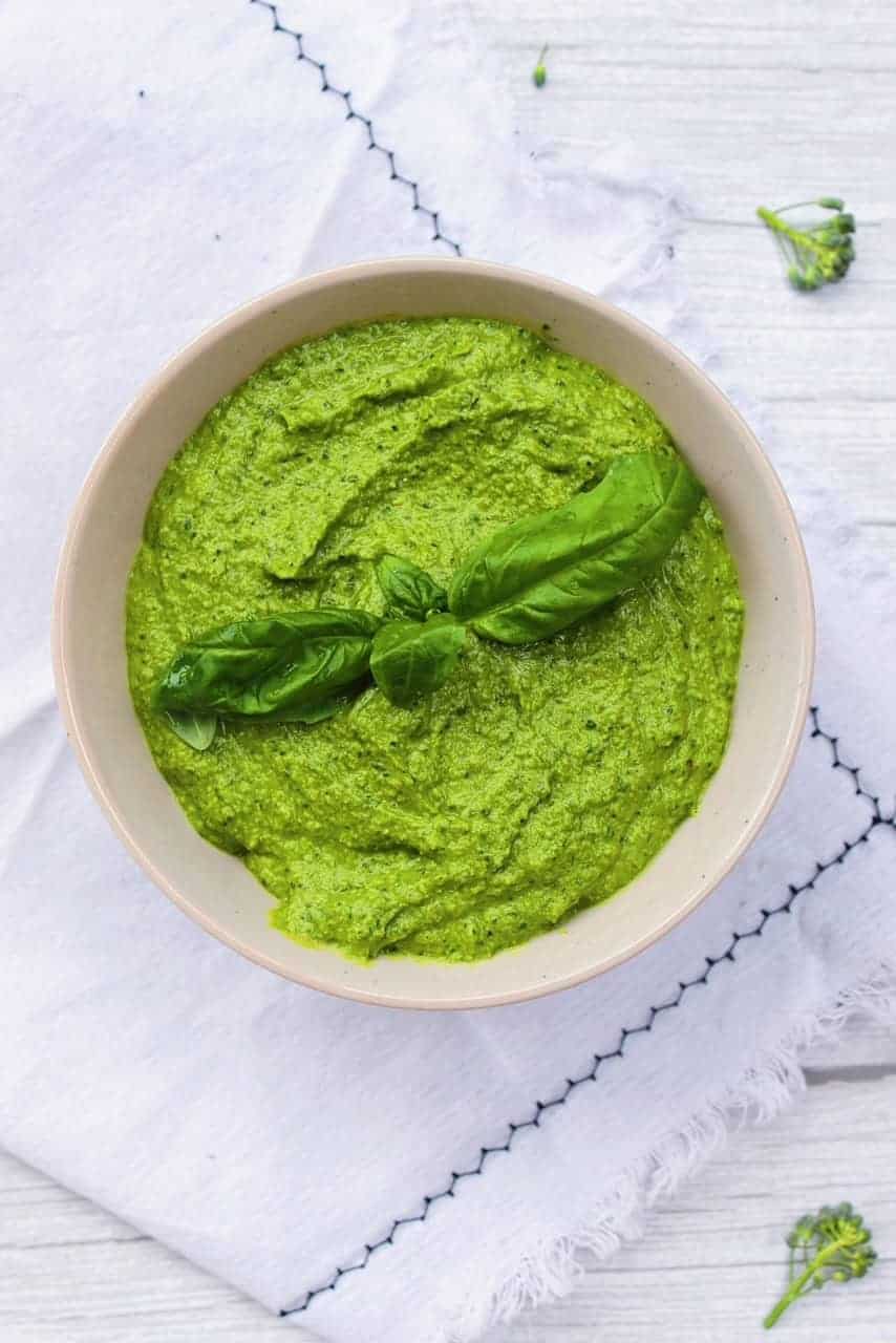 Broccoli Pesto in a bowl on a disk towel. 