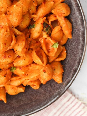 Gigi Hadid Pasta with spicy vodka sauce in charcoal bowl.