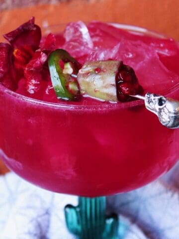 Spicy prickly pear margarita in a cactus glass.