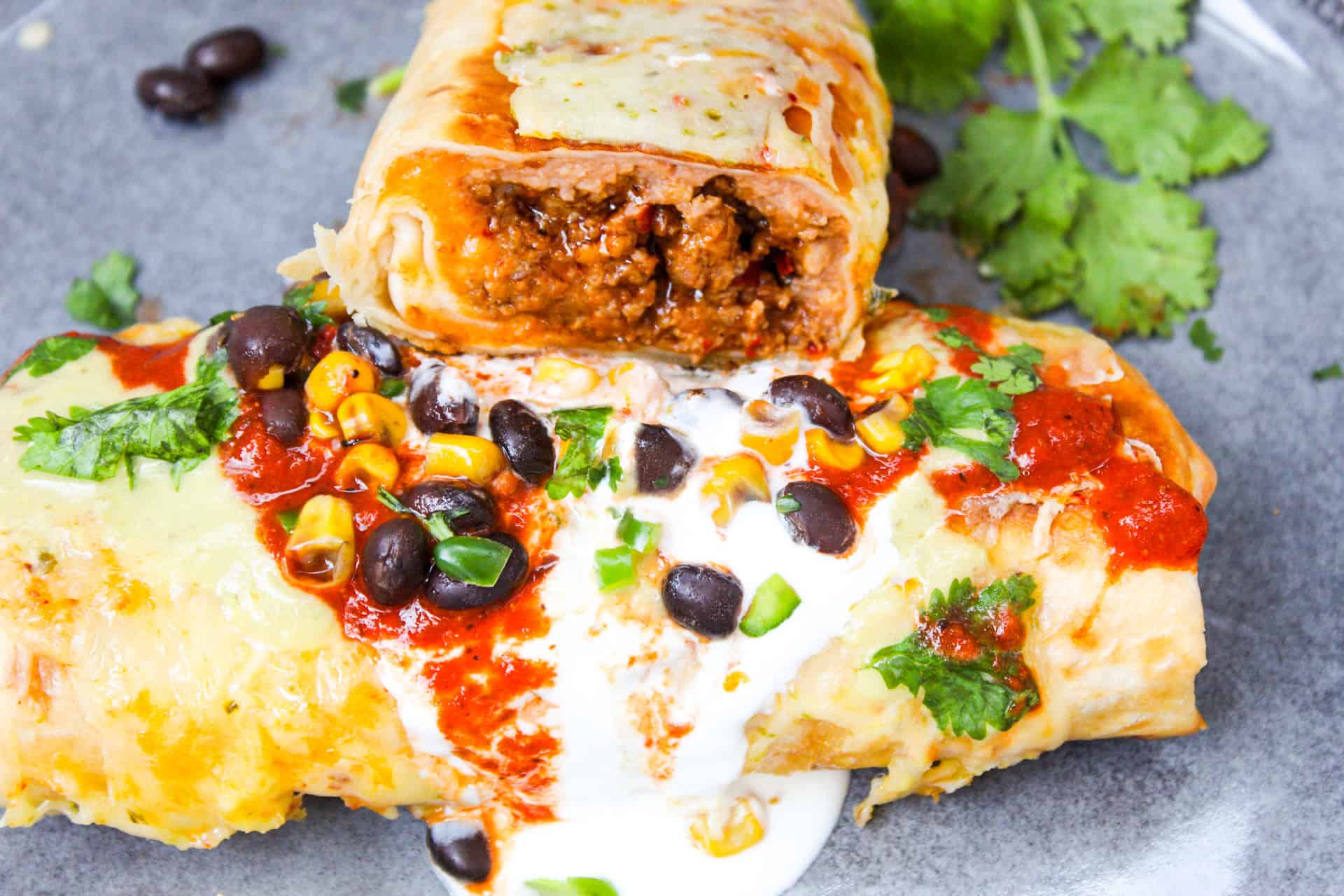 Two chimichangas with salsa. 